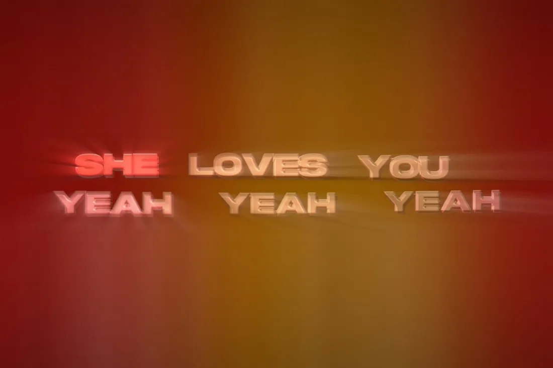 The sung word lit red, with light raking across the rest of the line